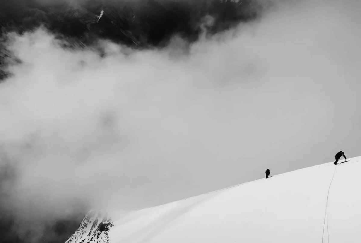 Climbers moving along a snowy ridge on Bhagirathi III during the Estrella Impossible expedition.