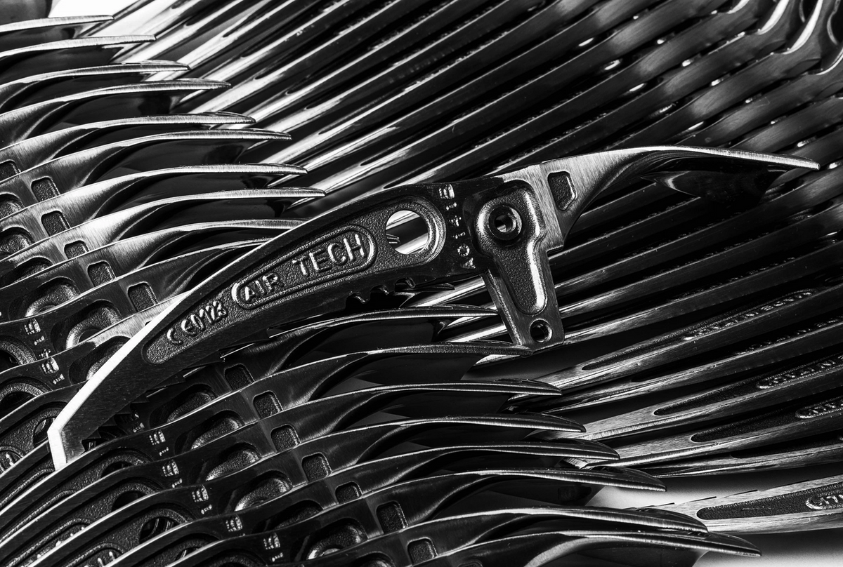 Close-up of Grivel Air Tech hot forged ice axe blades showing precision manufacturing details.